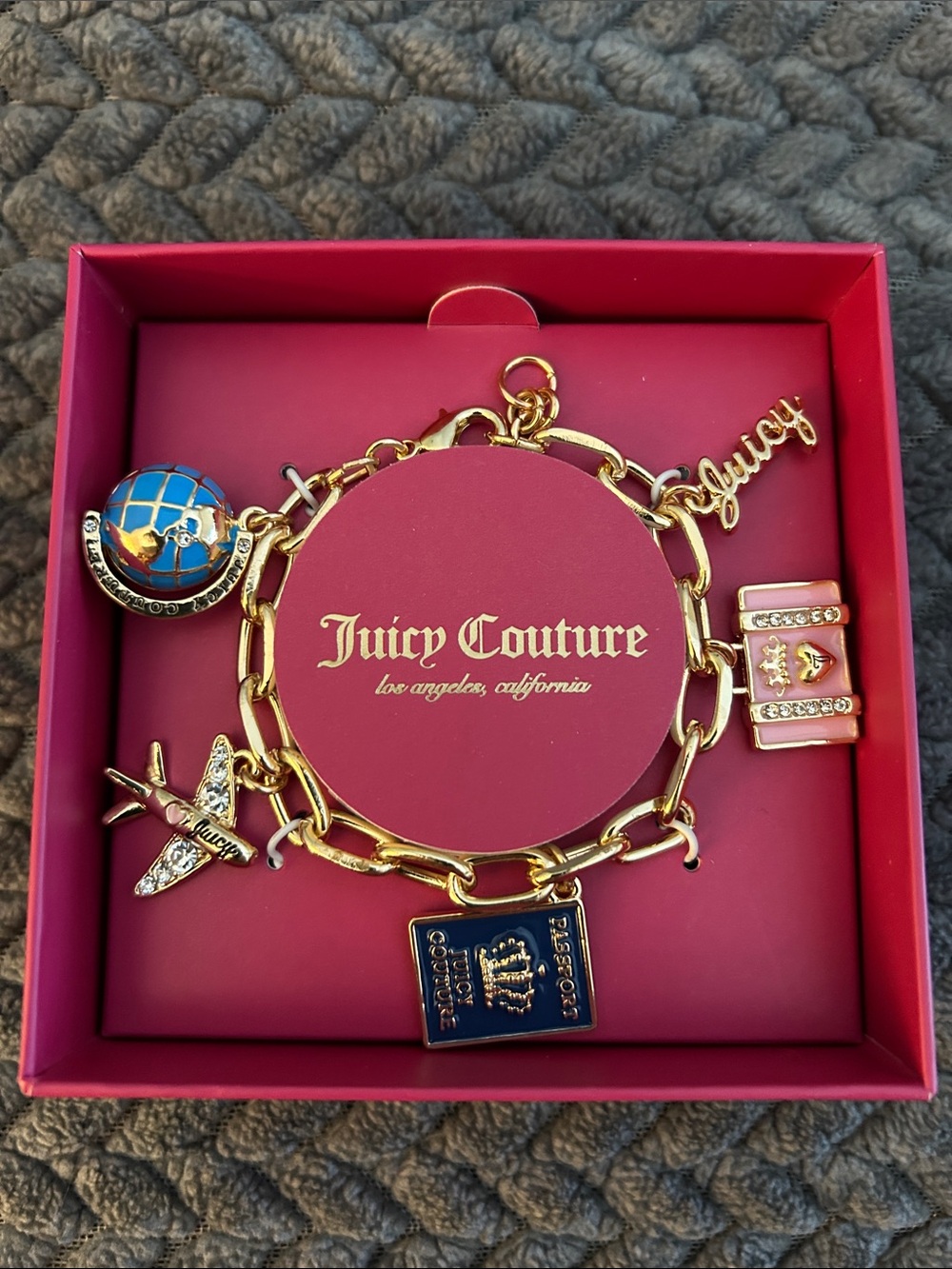 Juicy Couture Gold Travel Charm Bracelet with Blue Enamel Accents
